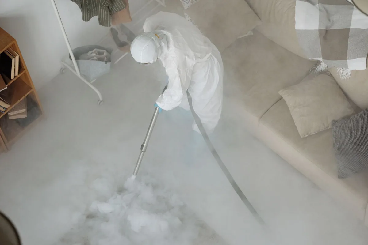 Biohazard cleanup technician in protective equipment, Maywood, NJ